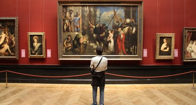 VIENNA - SEPTEMBER 8: Tourist admires art in Museum of Art History on September 8, 2011 in Vienna. With 559k visitors in 2010, the museum is among 100 most visited museums worldwide. Art of Rubens.