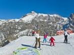 INNSBRUCK, AUSTRIA - MARCH 14: Families enjoy skiing at Alp mountain, Innsbruck, Austria on March 14, 2012. Innsbruck belongs to one of the best winter sports regions of the Alps.